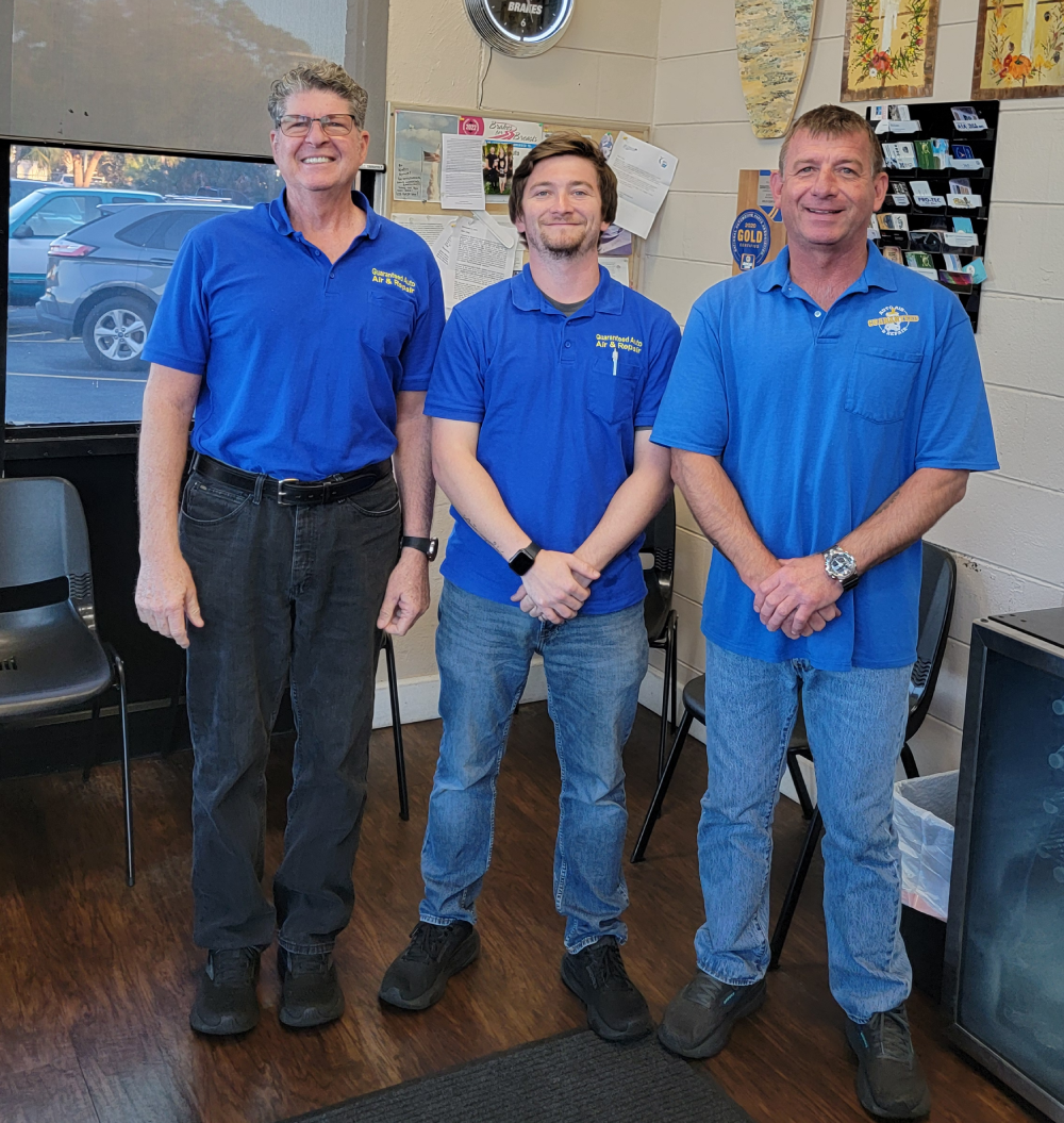 The Guaranteed Auto Air & Repair team inside the Rockledge shop